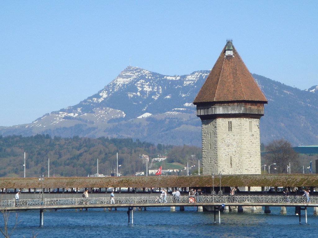 The Water Tower adjacent to the Chapel Bridge (Kappelbrucke) in Lucerne with Rigi in the background