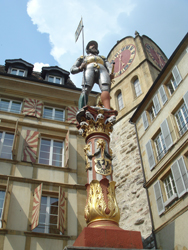 Statue above a fountain in the old town of Neuchâtel